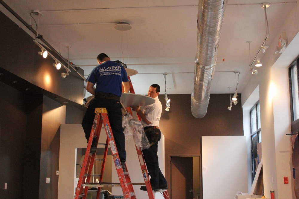 AllStar Electrical Services - Installing a ceiling light