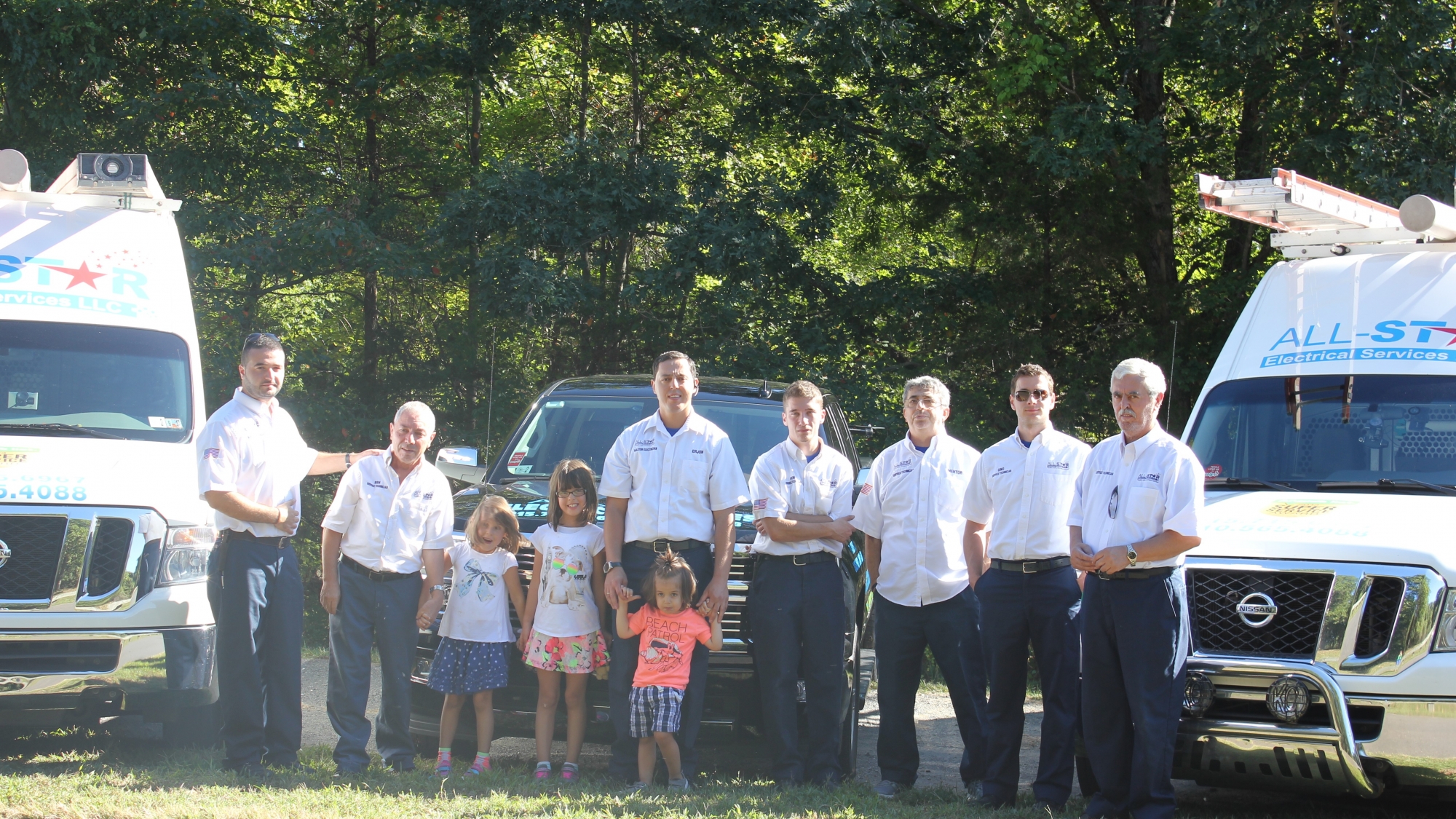 The men from All Star Electrical Services, LLC posing with their daughters